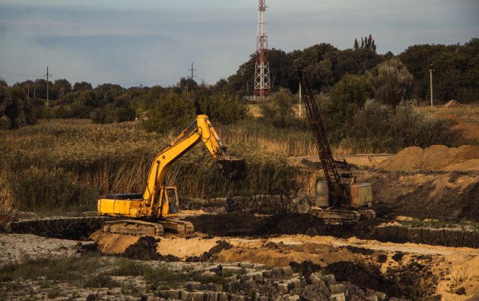 closeup-shot-ongoing-construction-with-tracks-bulldozer-abandoned-land