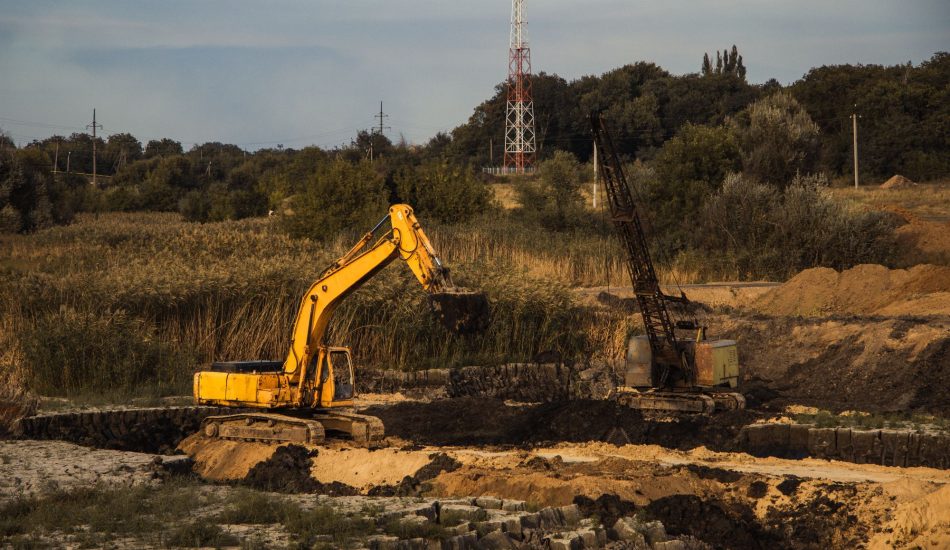 closeup-shot-ongoing-construction-with-tracks-bulldozer-abandoned-land